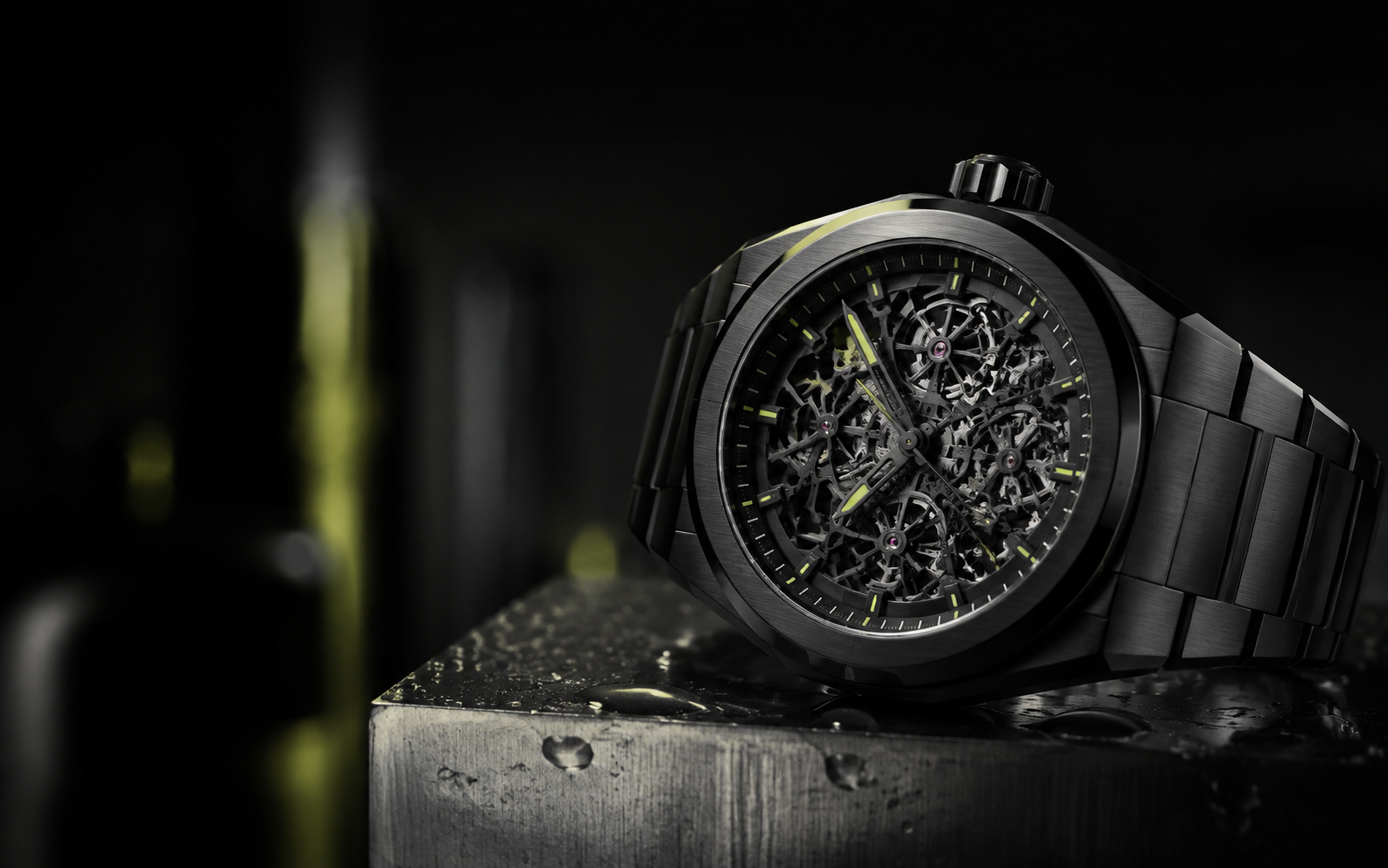 Black skeleton mechanical watch on a steel plinth